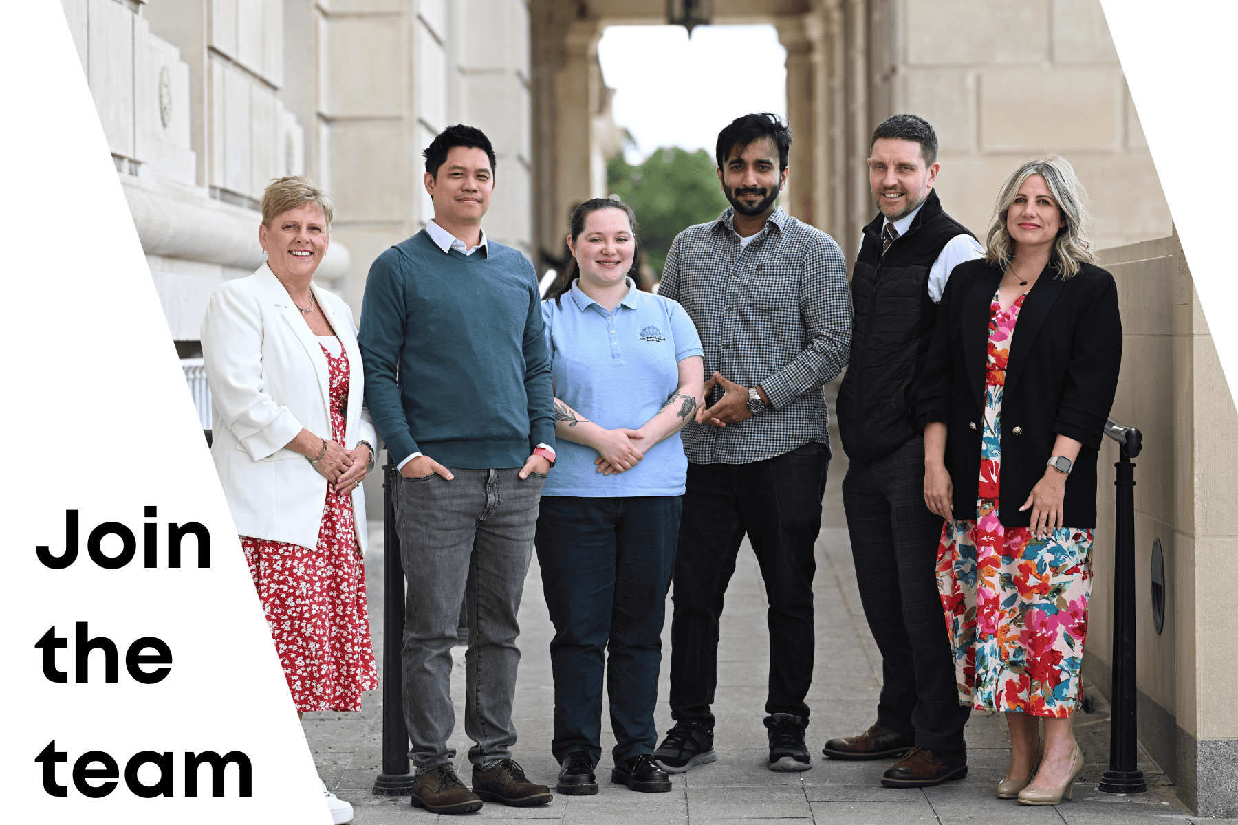 Group of six people standing side by side outside Parliament Buildings, facing the camera, wearing a mix of business and casual clothing. On the left side of the image, bold text reads “Join the team.”