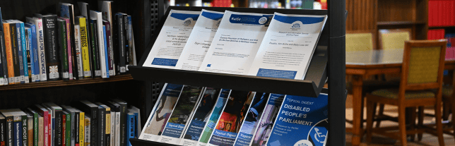 leaflets on a shelf in a library