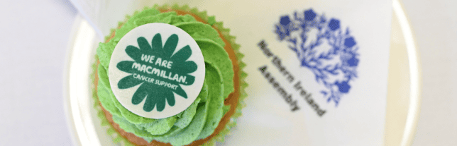 a cupcake with a MacMillan cancer topper