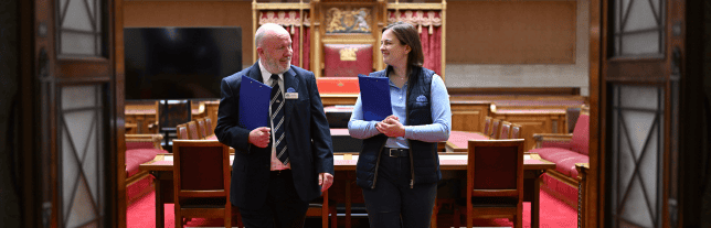 two colleagues inside the senate chamber at the NI assembly